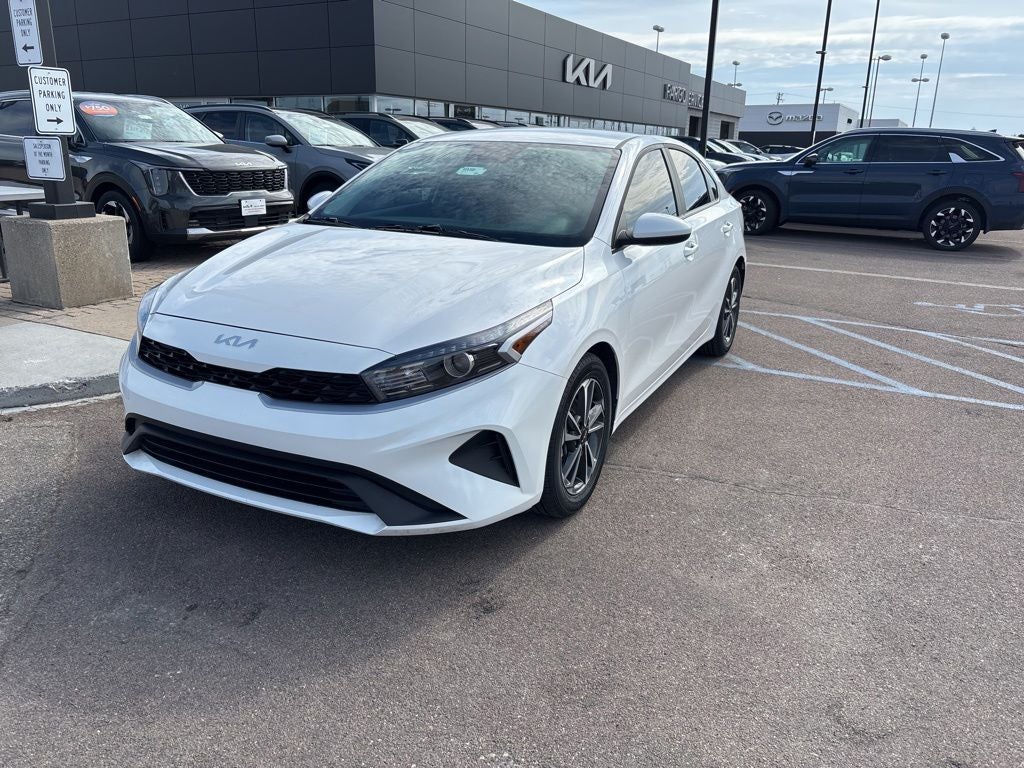 2024 Kia Forte LXS in Snow White Pearl — front three-quarter view