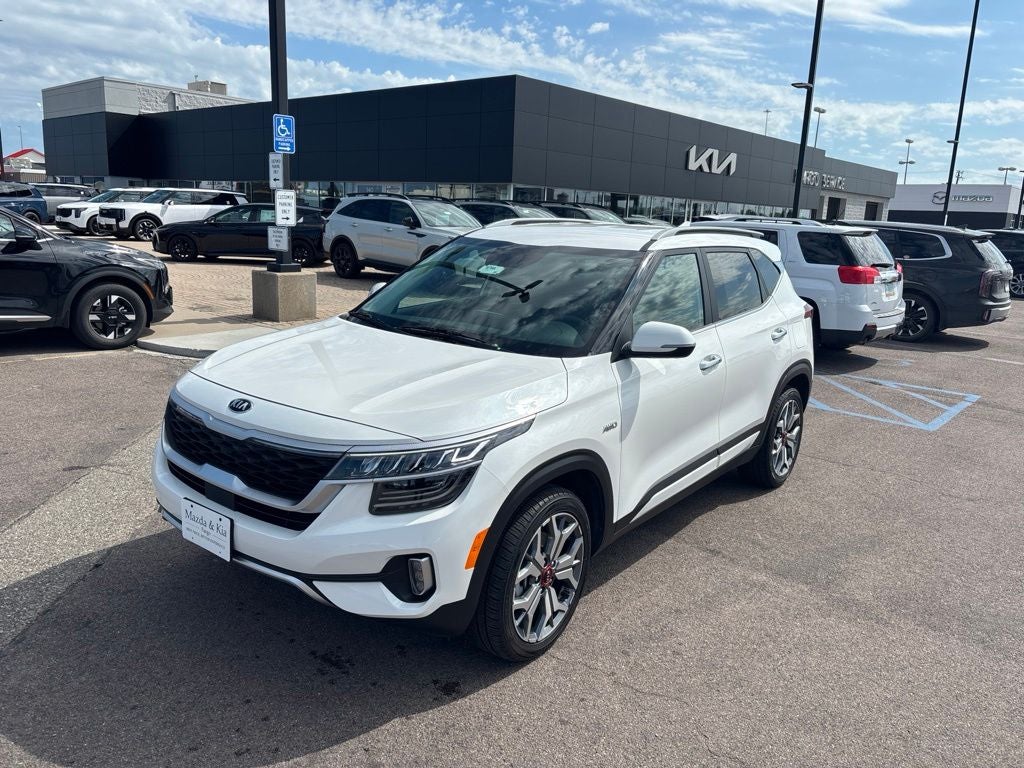 2021 Kia Seltos SX in Snow White Pearl — front three-quarter view