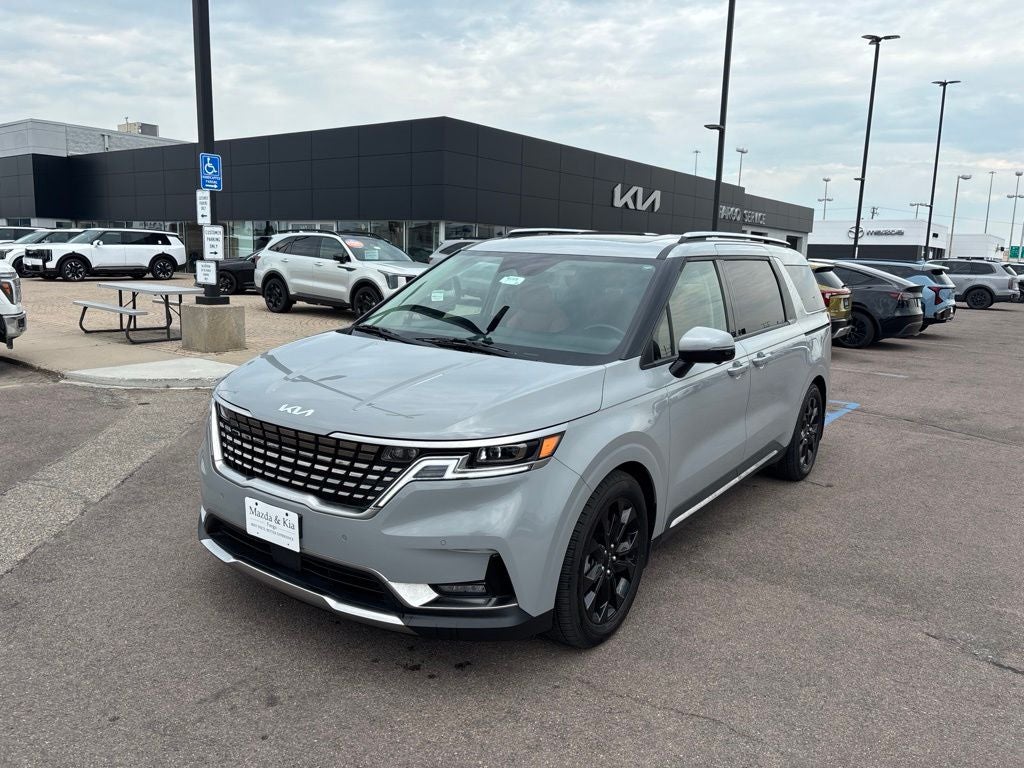 2024 Kia Carnival SX Prestige in Ceramic Silver — front three-quarter view
